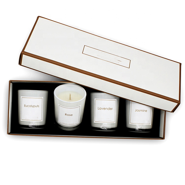 Four scented candle jars packed in a custom gift box