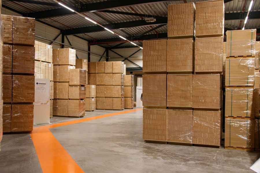Stacked cardboard cartons in a warehouse
