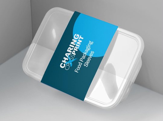 Printed paper sleeve wrapped around clear product trays